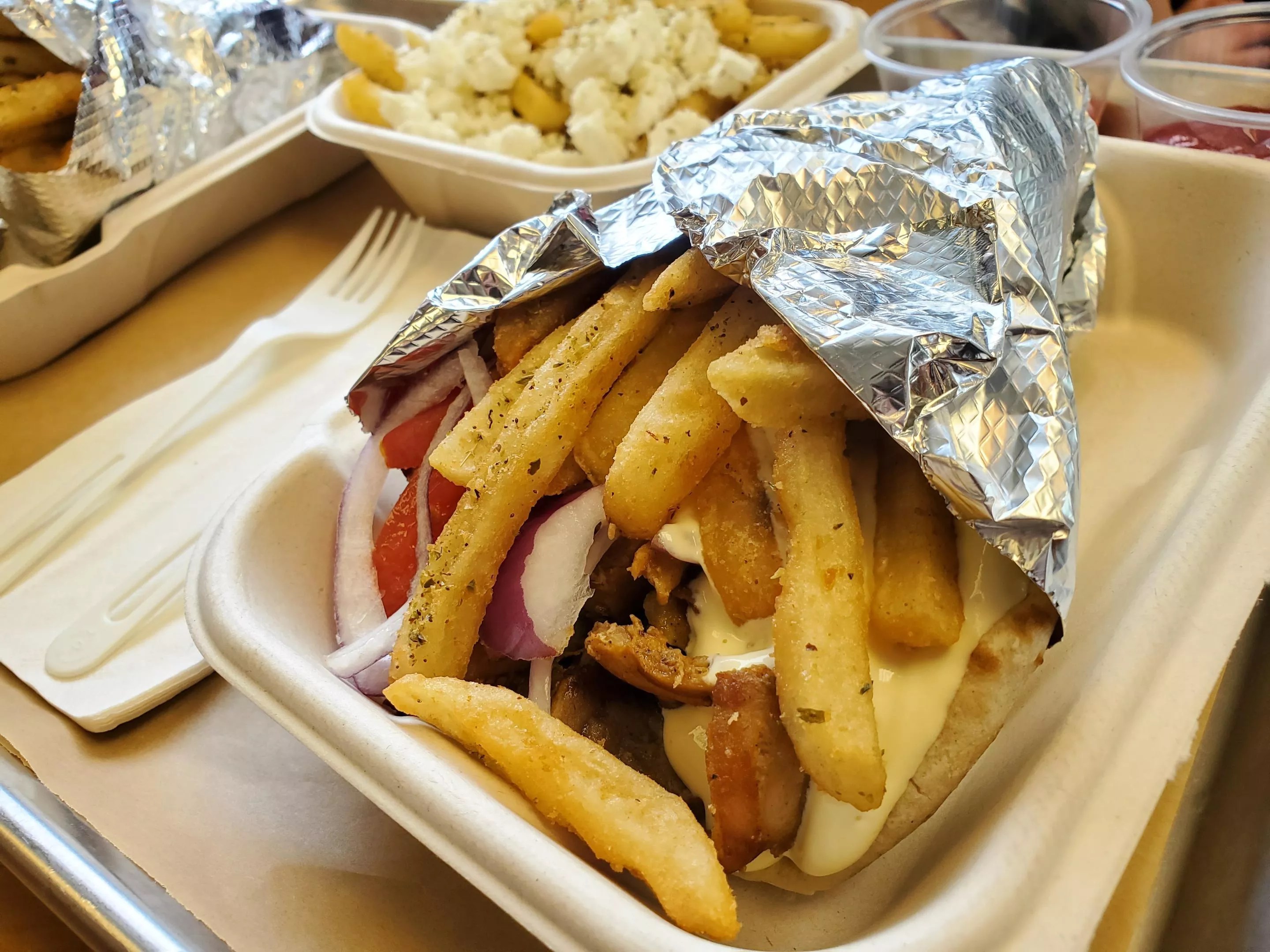 a gyro with fries inside