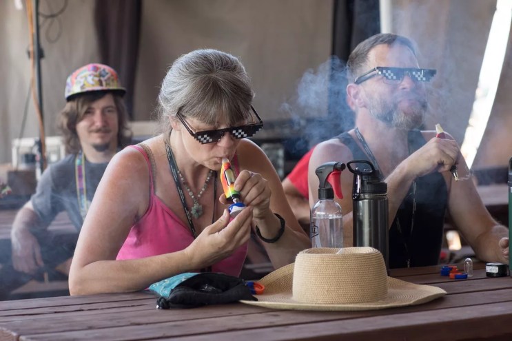 Man and woman hit dabs