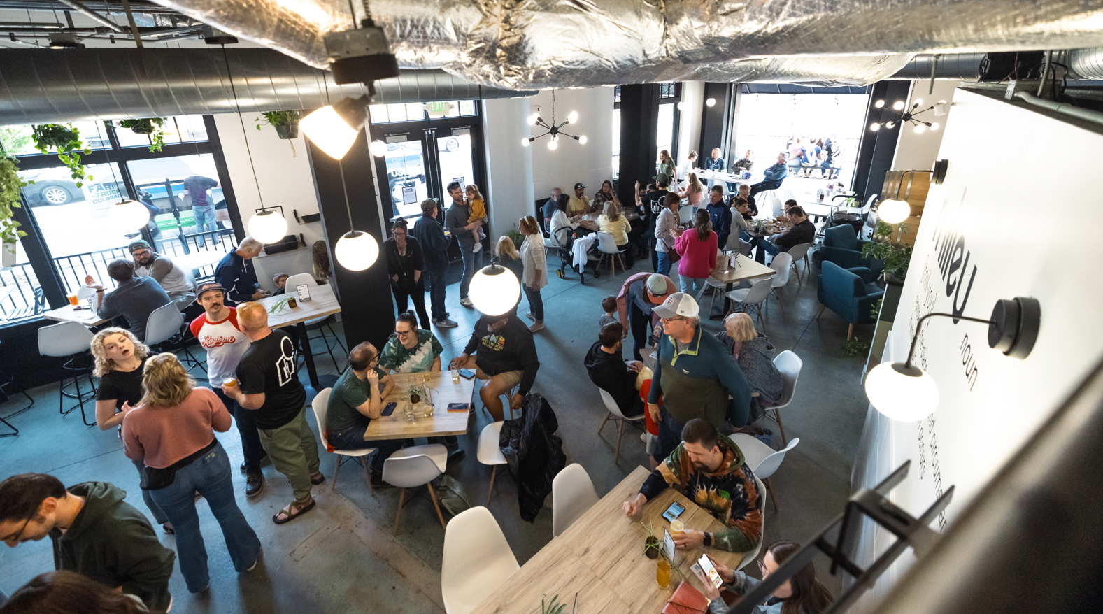 Patrons inside a brewery tap room.