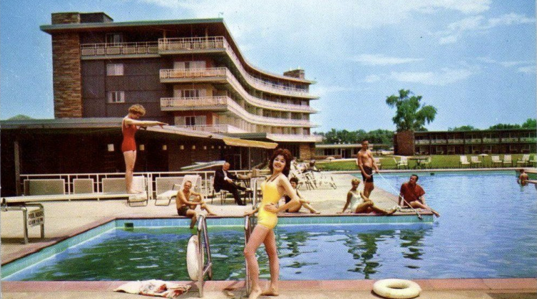 Postcard of pool and hotel in the 1960s