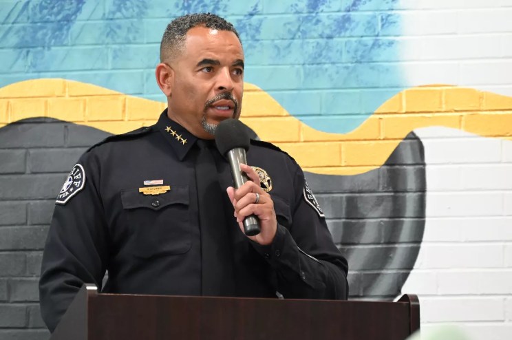 man in uniform at mike.