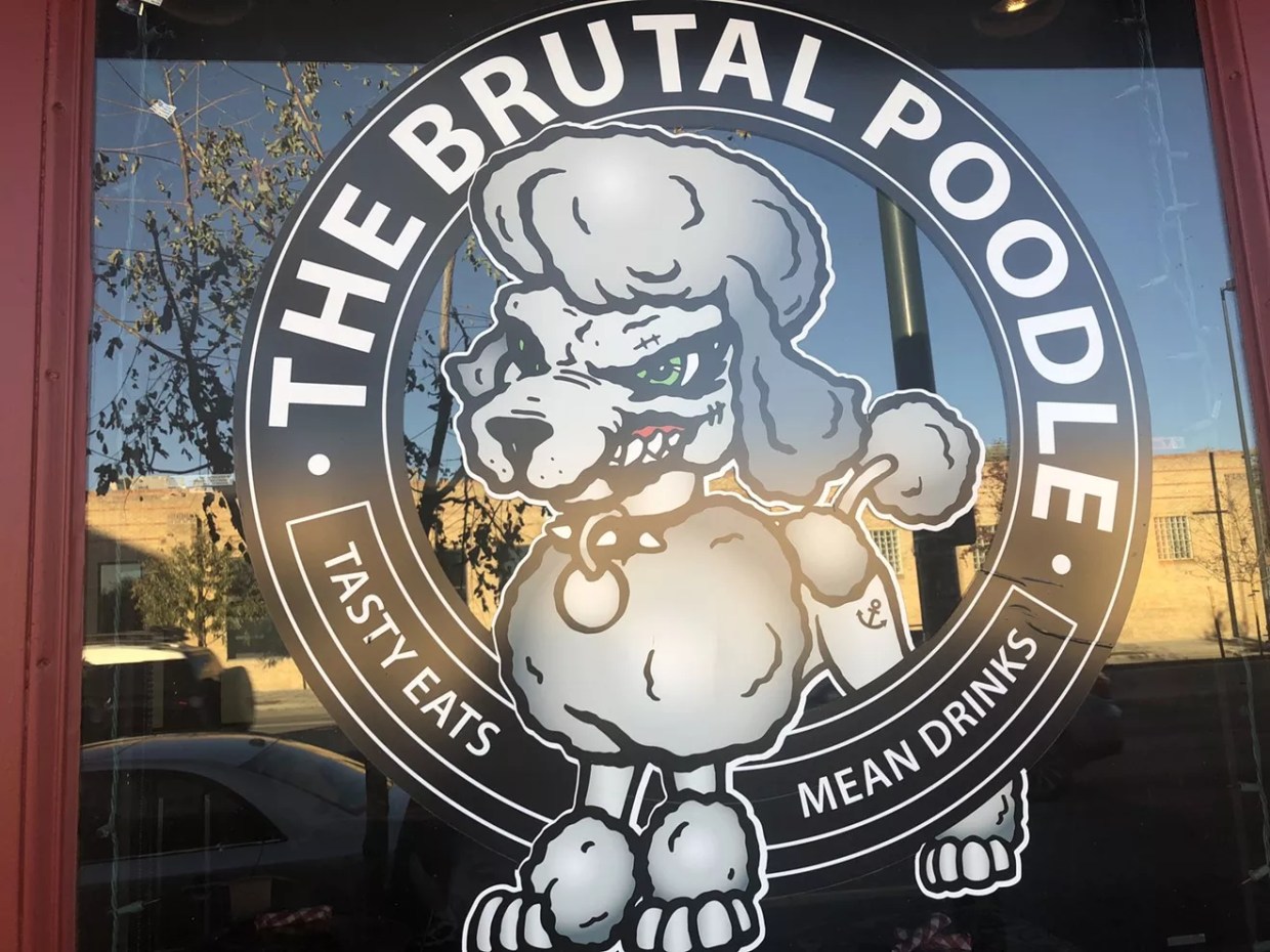 door with poodle sign