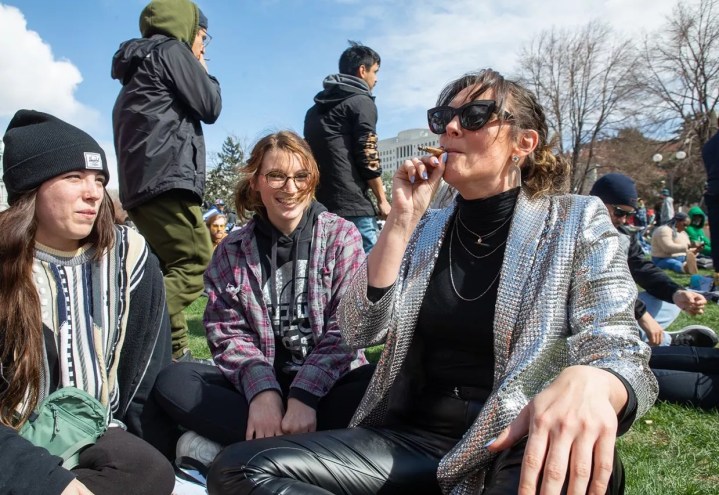 Group of women smokes marijuana at the park