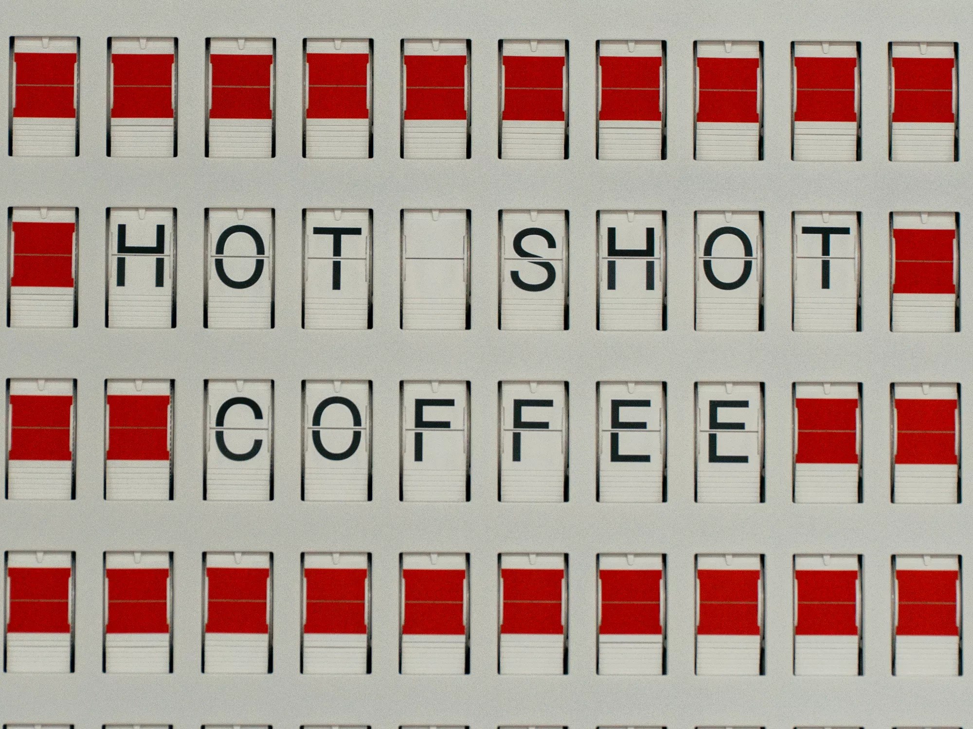 red and white graphic that says "hot shot coffee"
