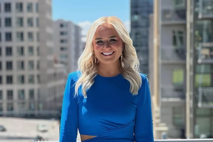 woman in blue before skyline