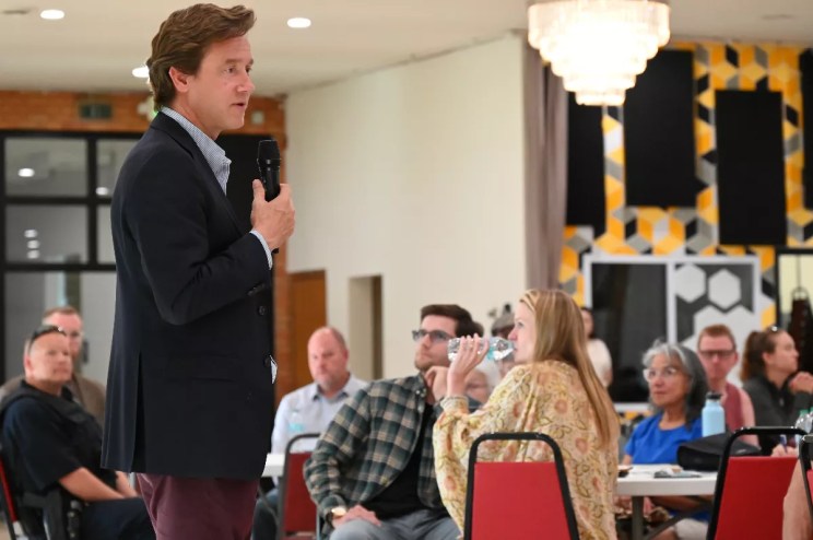 A man talks to people.