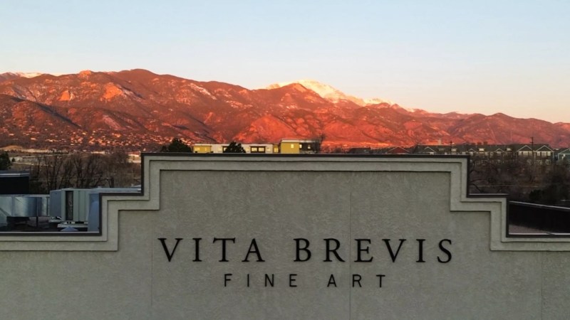 Sunset behind a building