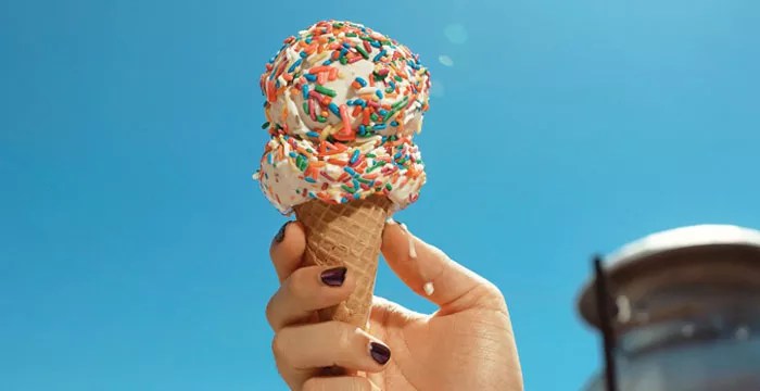 hand holding ice cream cone