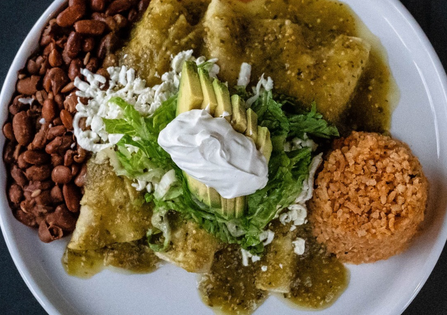 green enchiladas on a plate
