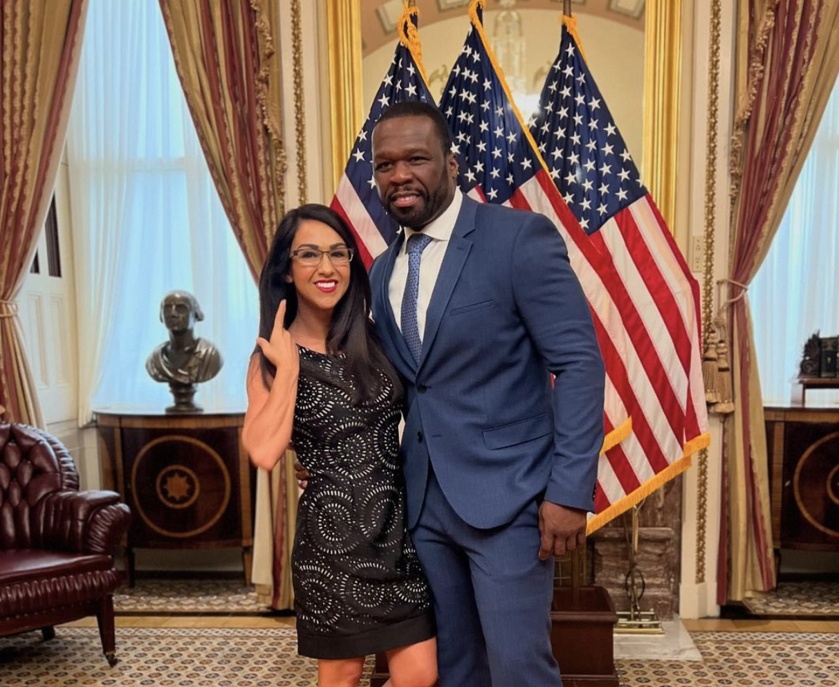 Congresswoman Lauren Boebert posing with rapper 50 Cent.