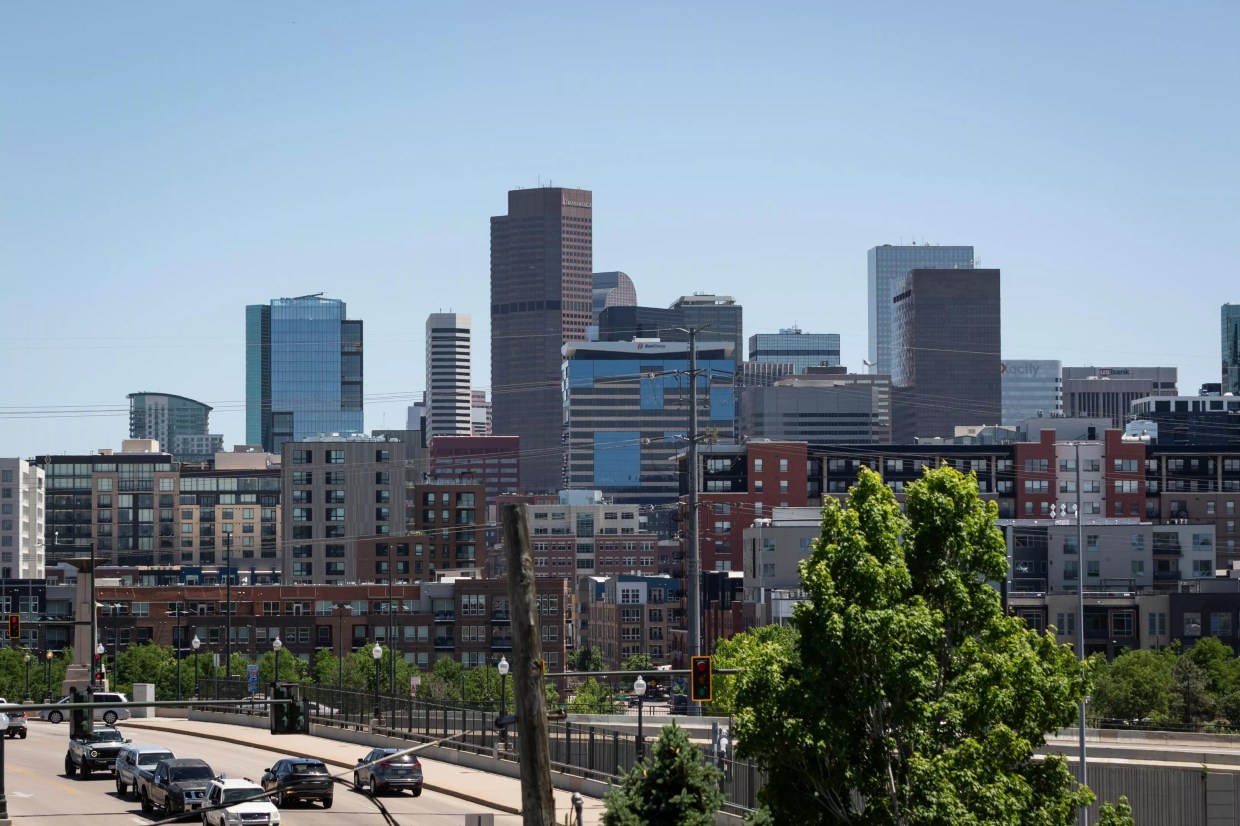 A view of Denver's dense skyline from Avanti Food & Beverage.