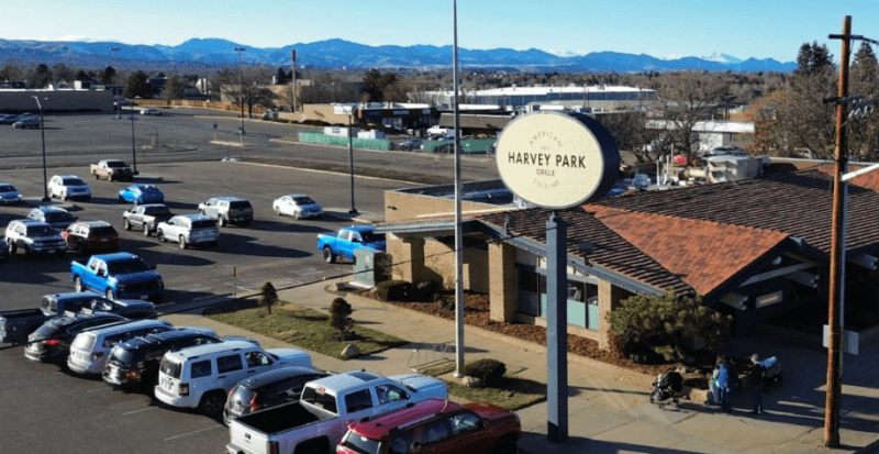 exterior of a building with an oval sign in front