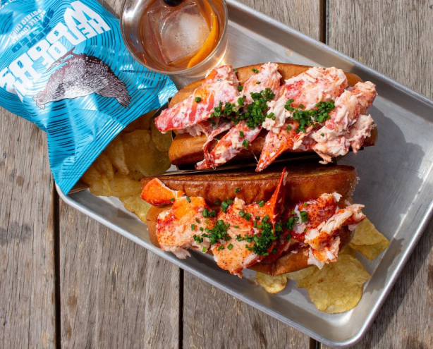 two lobster rolls on a tray