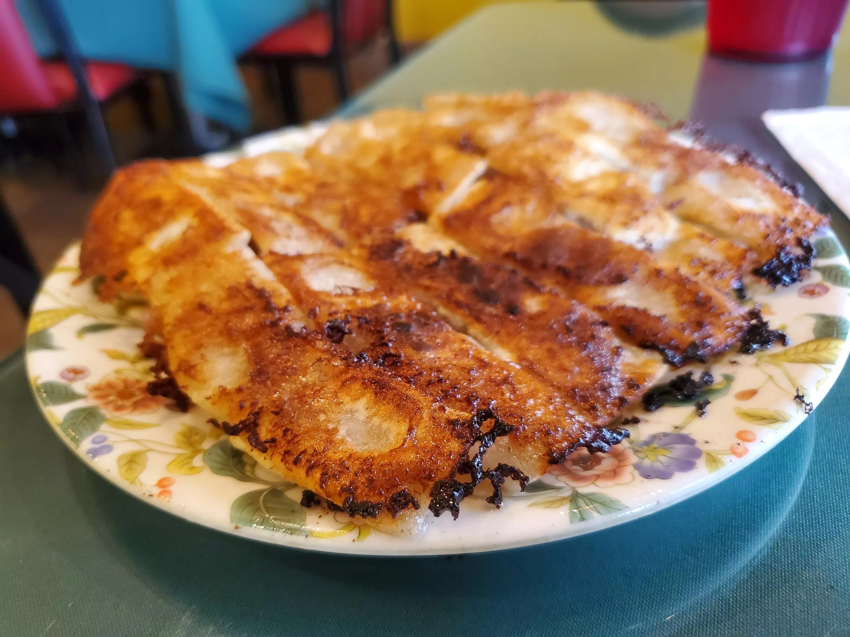 a plate of potstickers