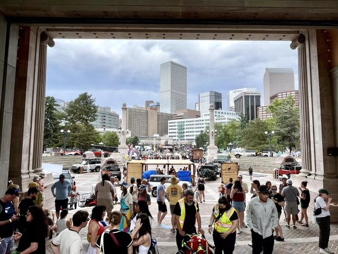 looking through outside amphitheatre at festival-goers