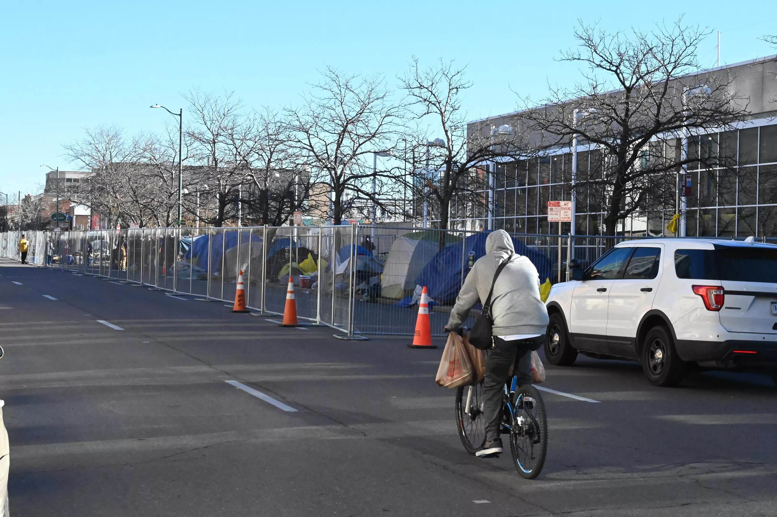 man in sweatshirt on bike