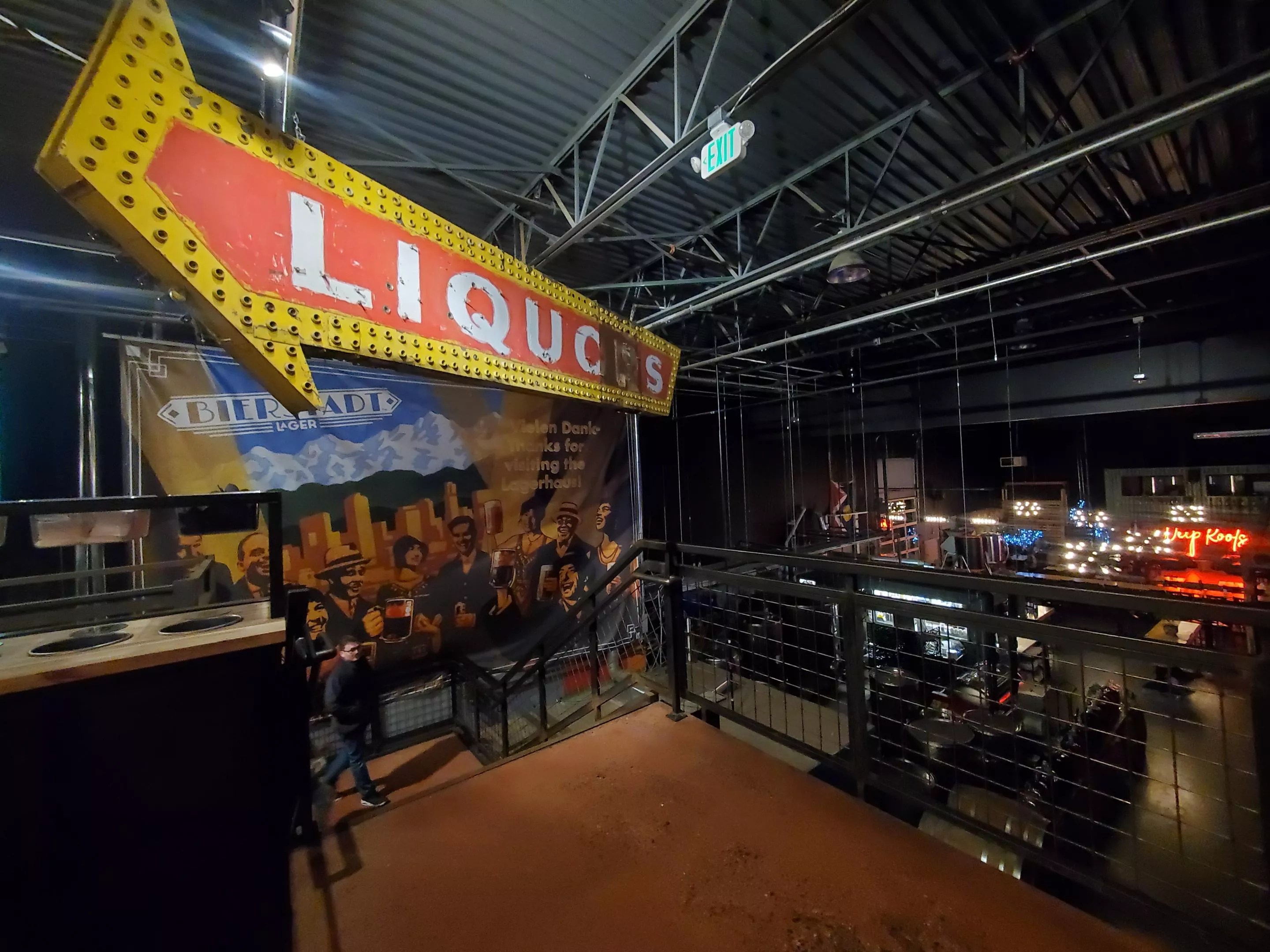 a vintage arrow "liquor" sign