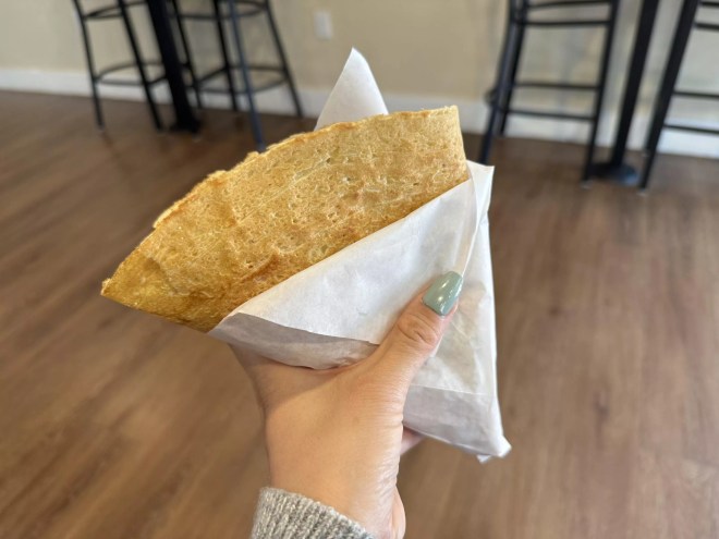 hand holding a folded crepe