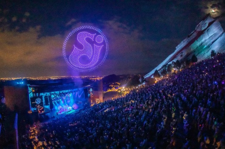 String Cheese Incident performing at Red Rocks with a drone show