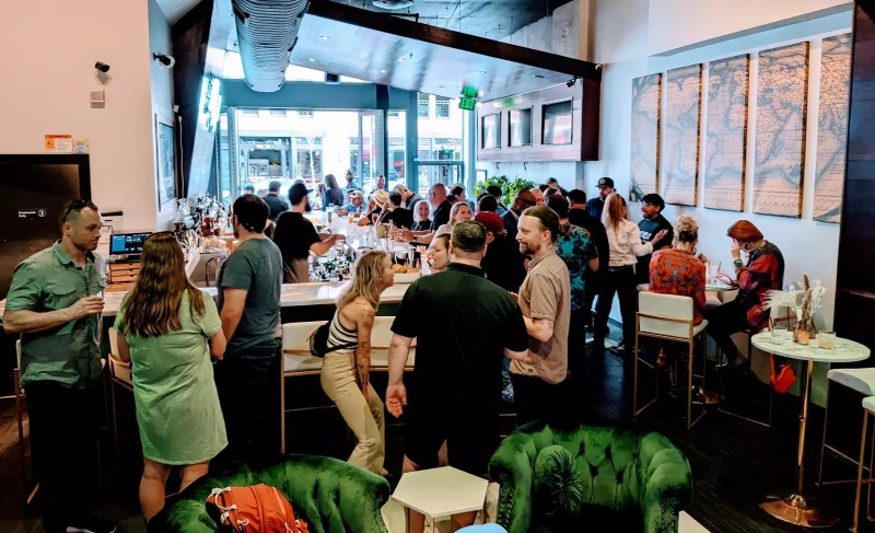 crowd of people inside a bar