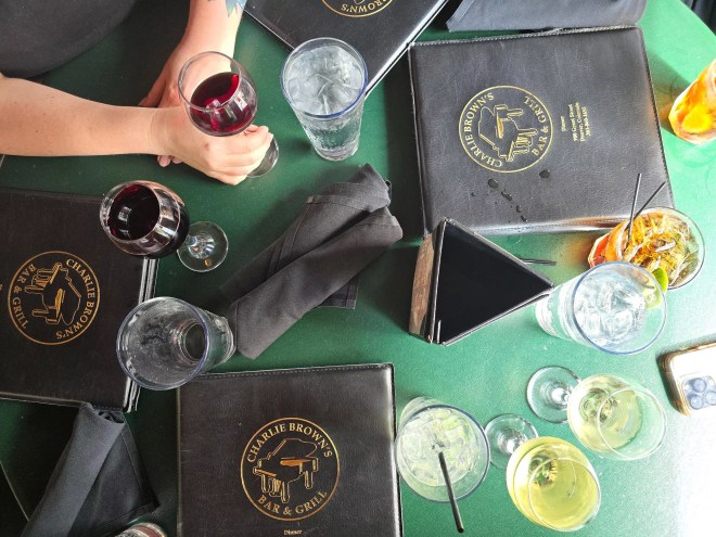 menus and various drinks on a table