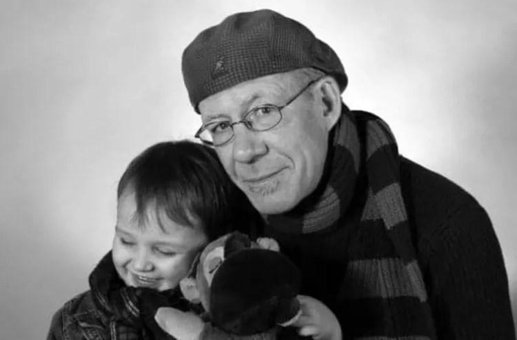 man in beret with boy