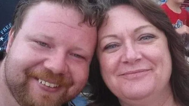 Adult son and mother take selfie together