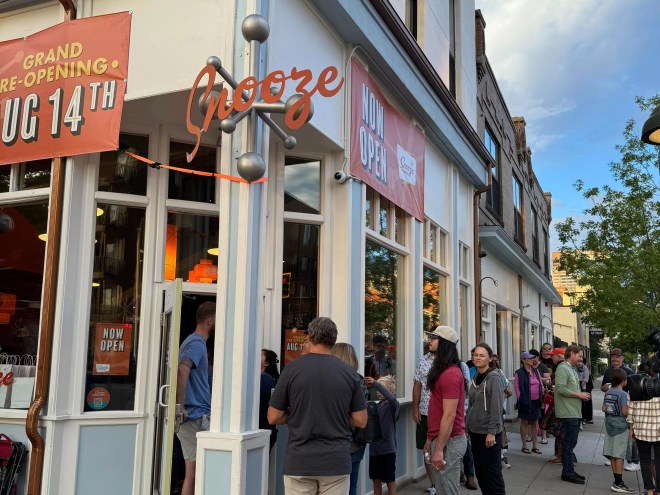 people standing outside a restaurant