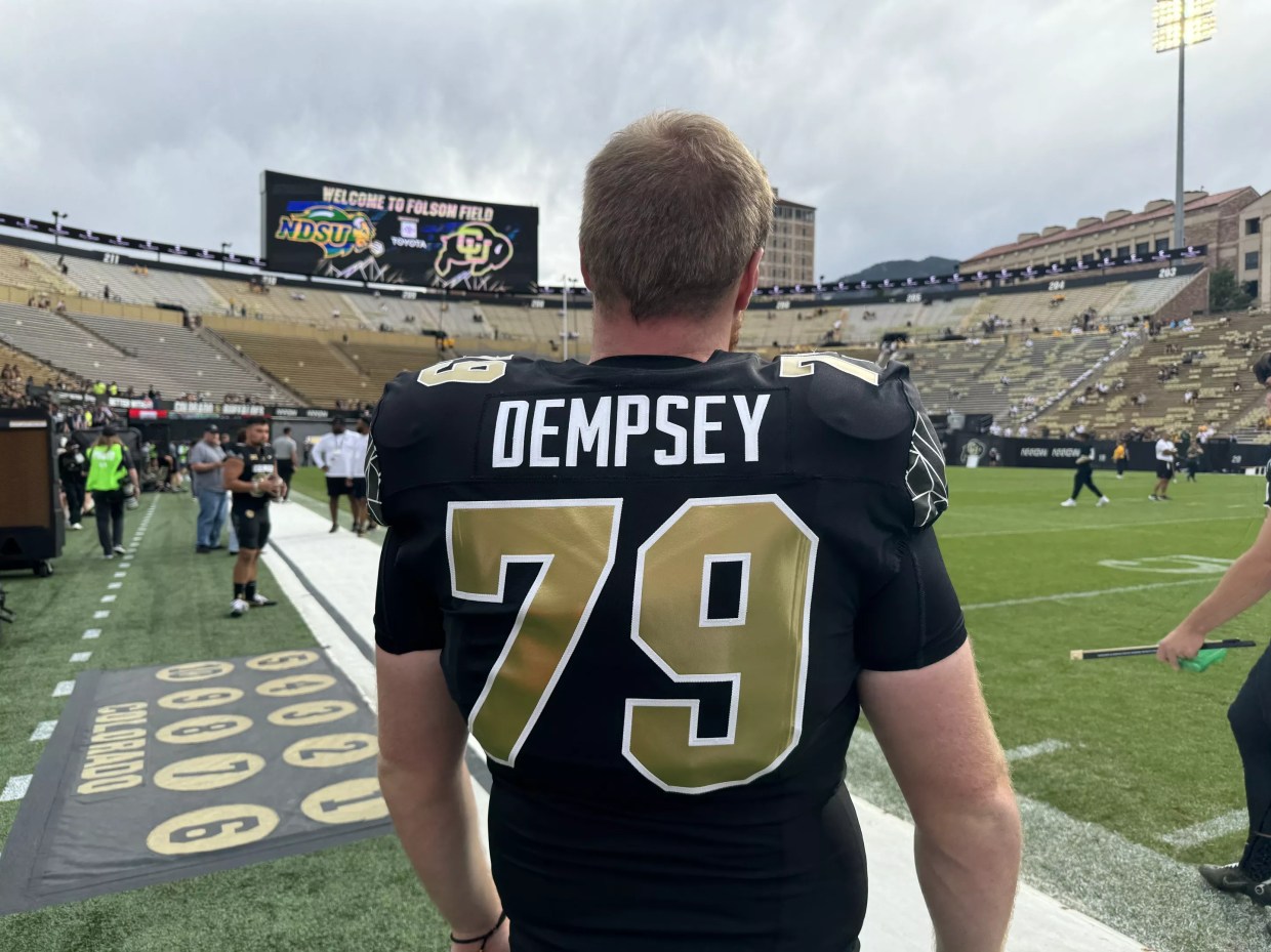 University of Colorado football player on sidelines.