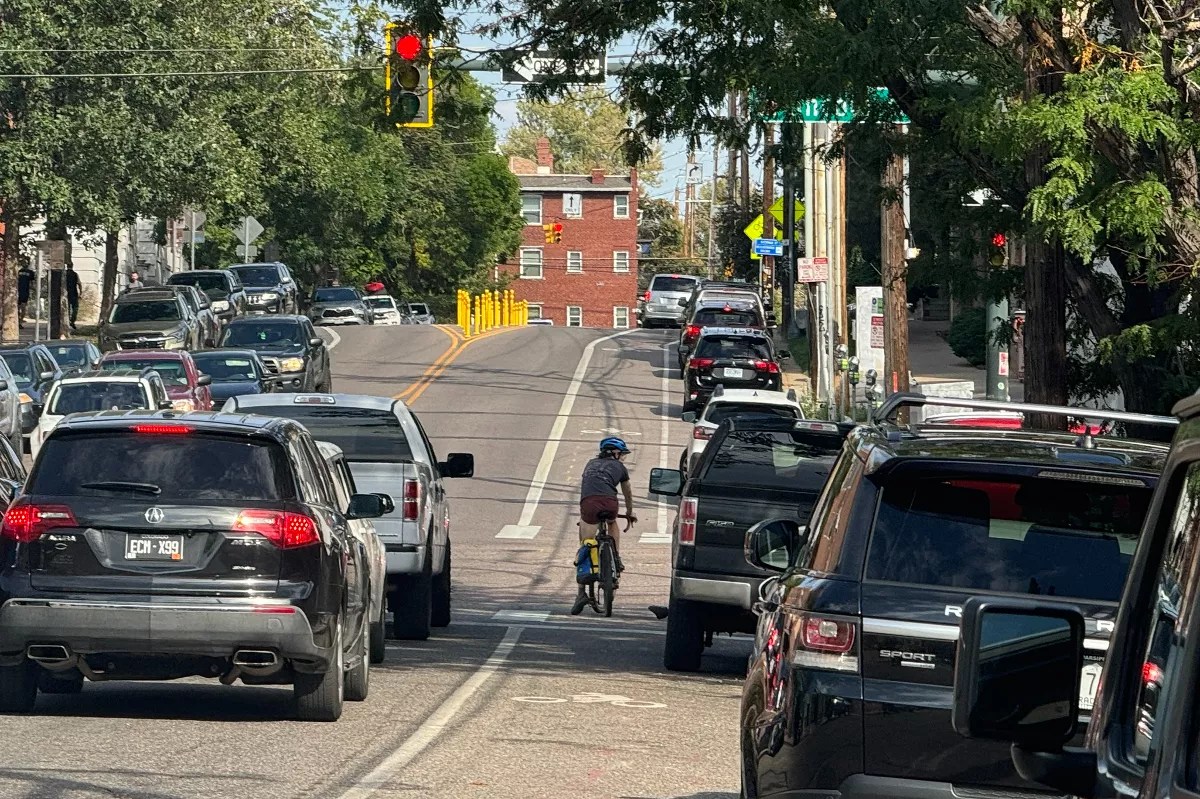 A cyclist goes down 11th Avenue in Denver