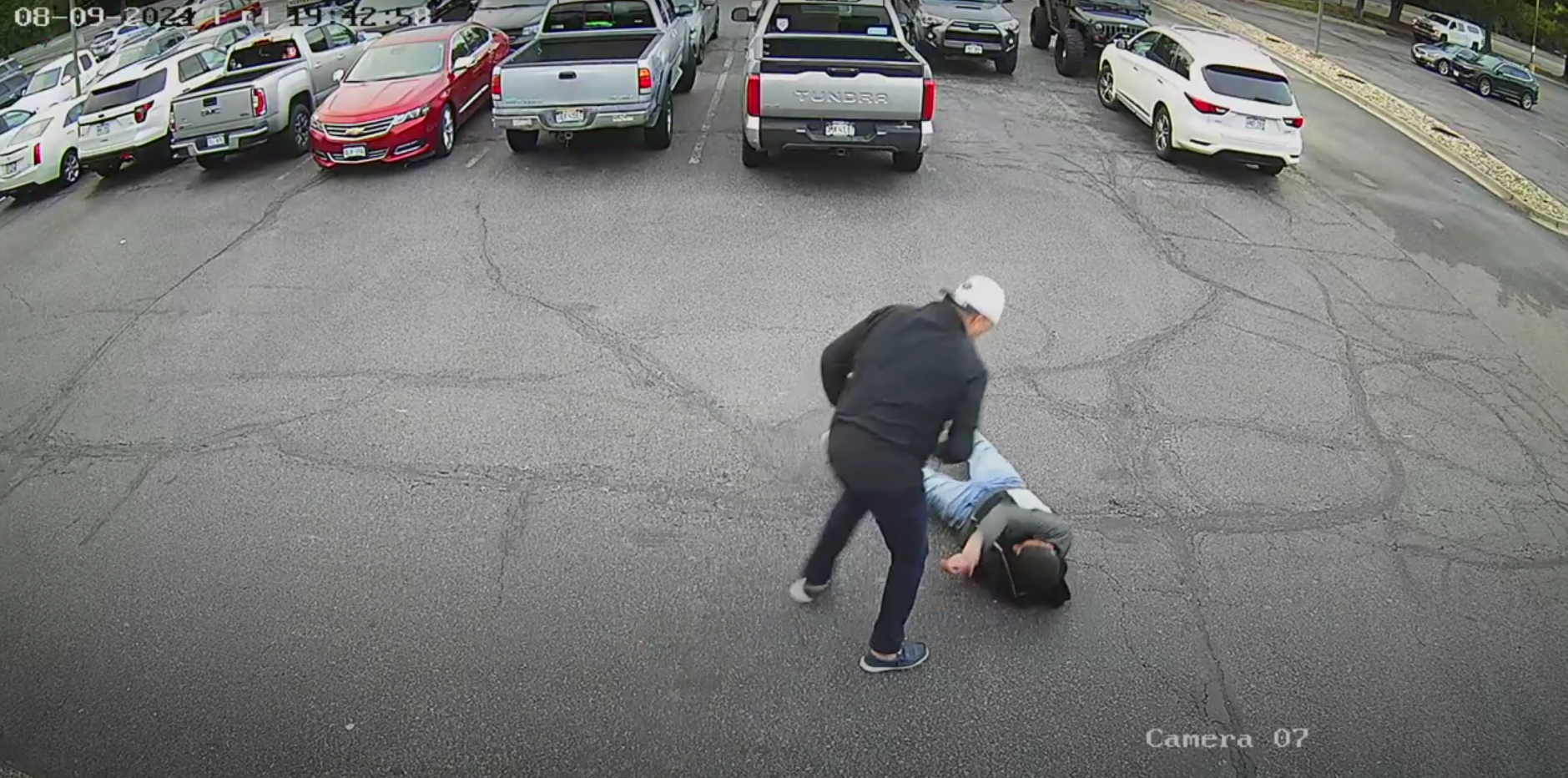 Man stands over knocked out man during fight