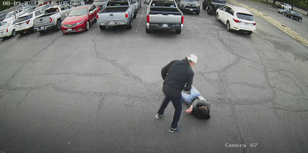 Man stands over knocked out man during fight