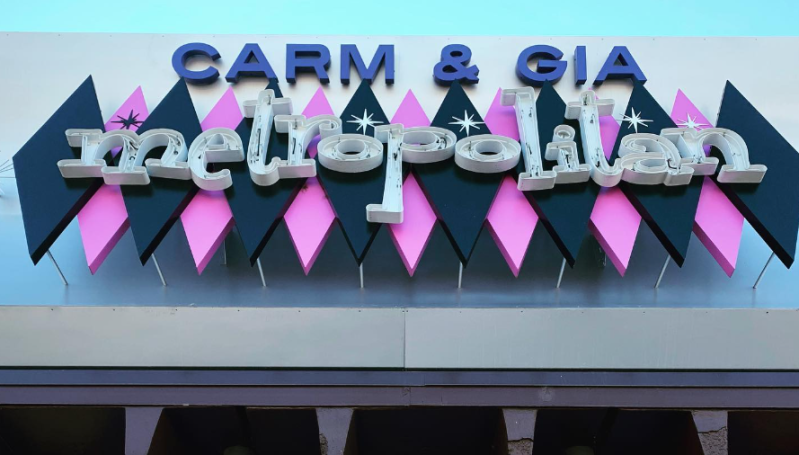a pink and black sign that says "carm & gia