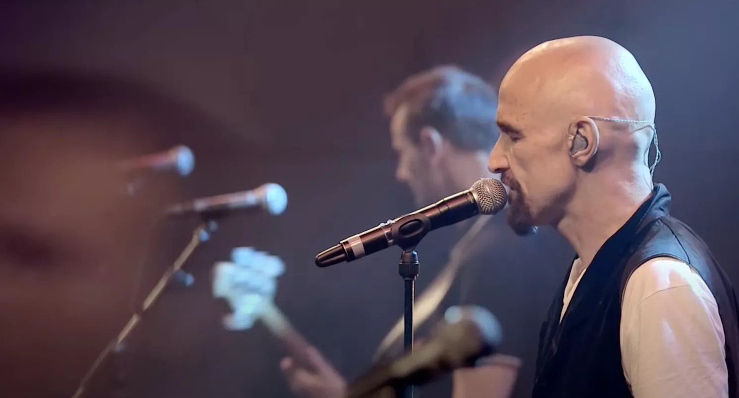 Tim Booth singing