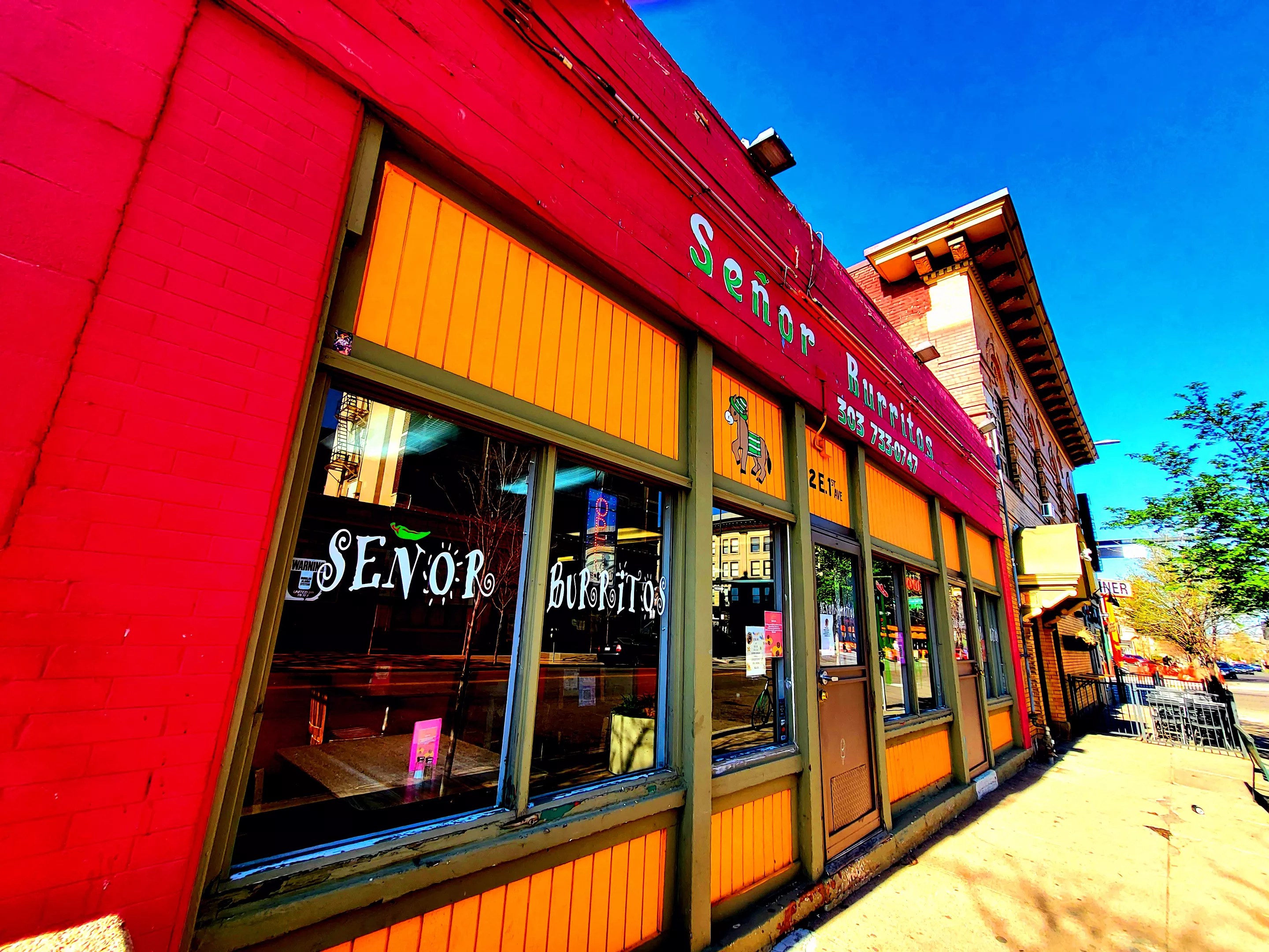 front of building with a red awning