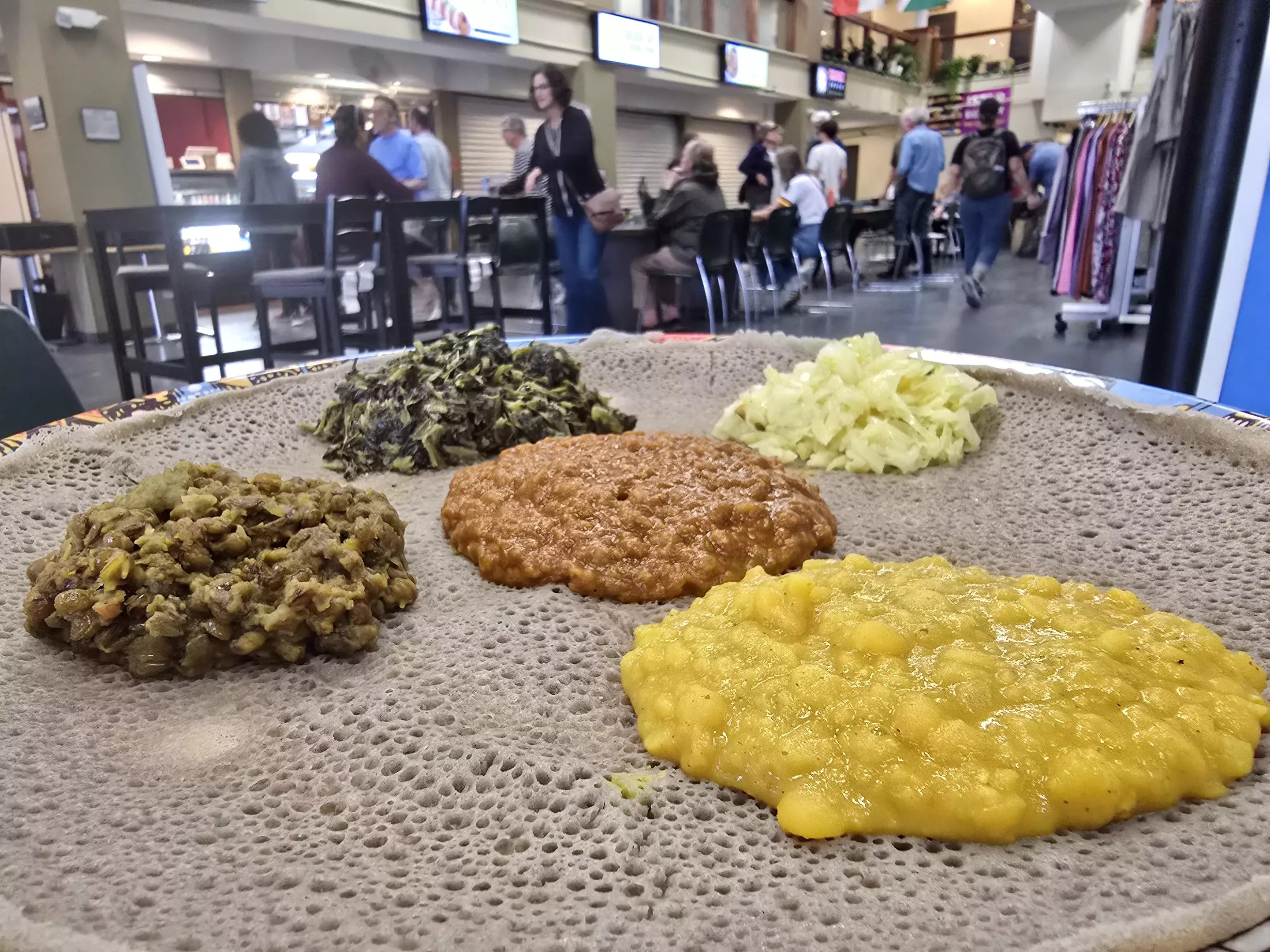 ethiopian injera bread topped with various veggie dishes
