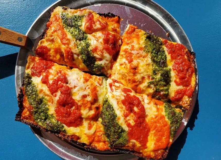 A Sicilian pizza from Dough Counter featuring marinara, vodka sauce and basil pesto