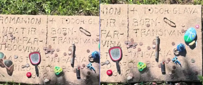 headstone in a cemetery with trinkets on it