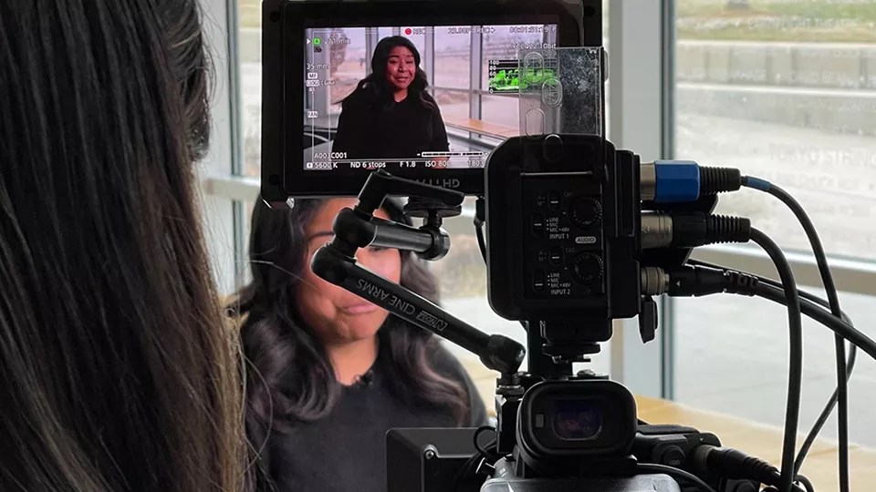 woman behind a camera lens