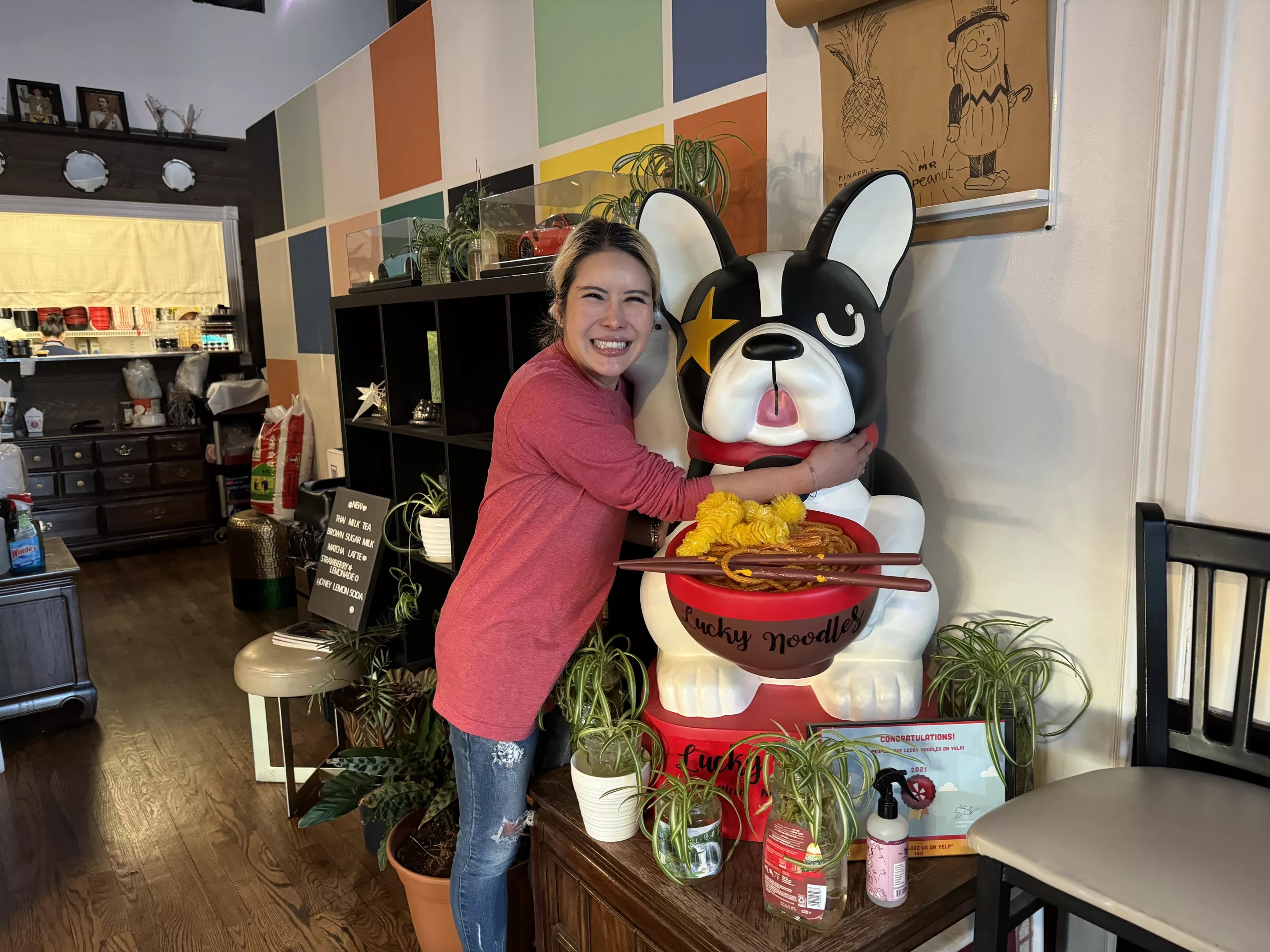 woman hugging bulldog statue