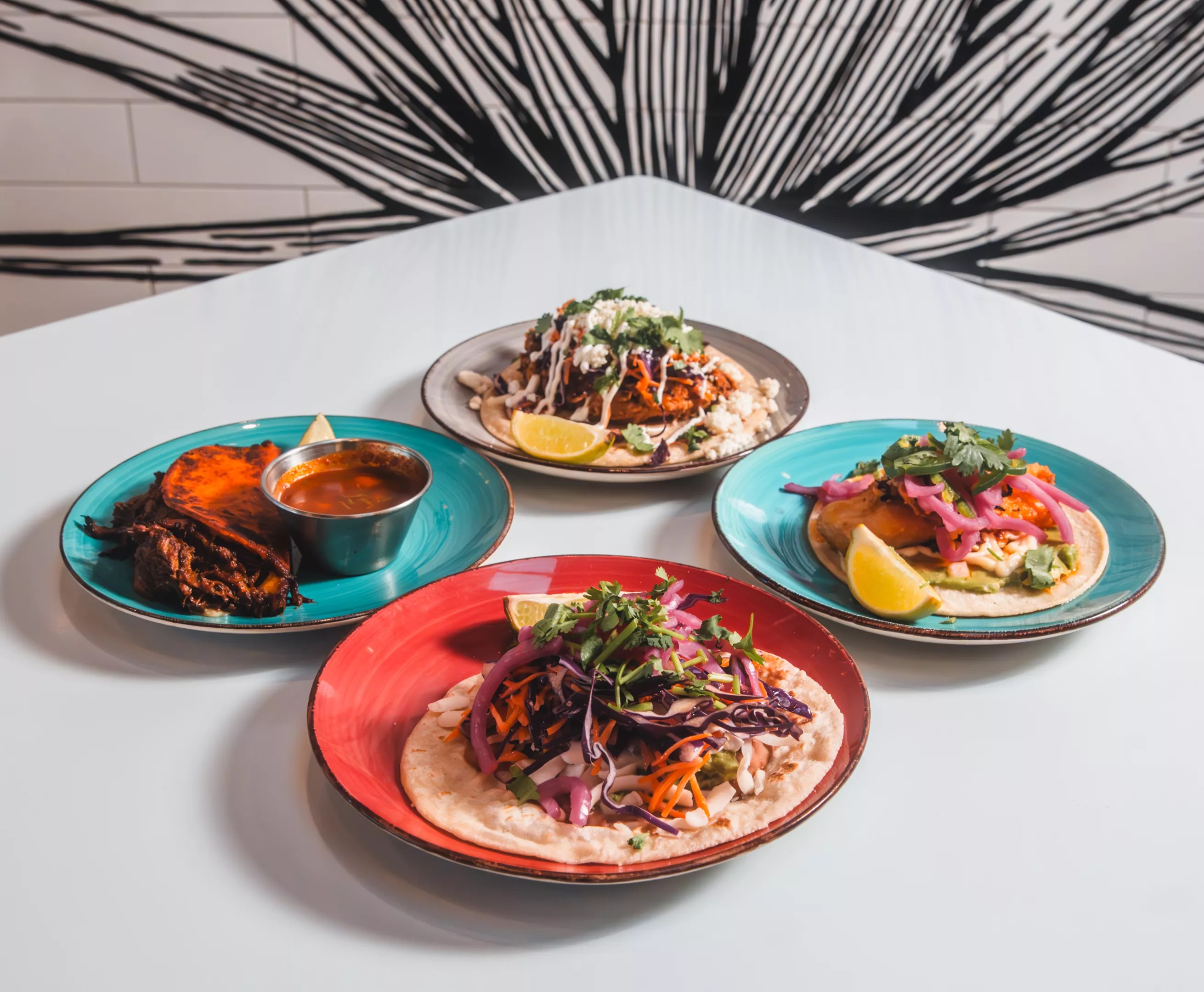 various tacos on plates