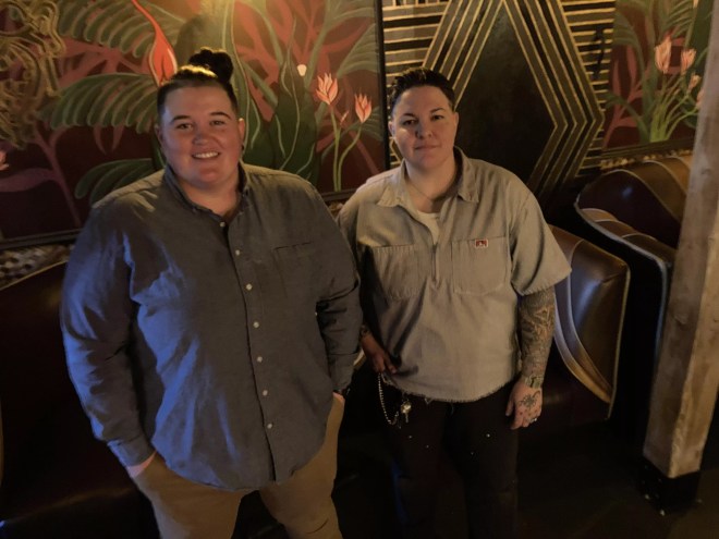 Ashlee Cassity and Dom Garcia standing inside their bar, Pearl Divers