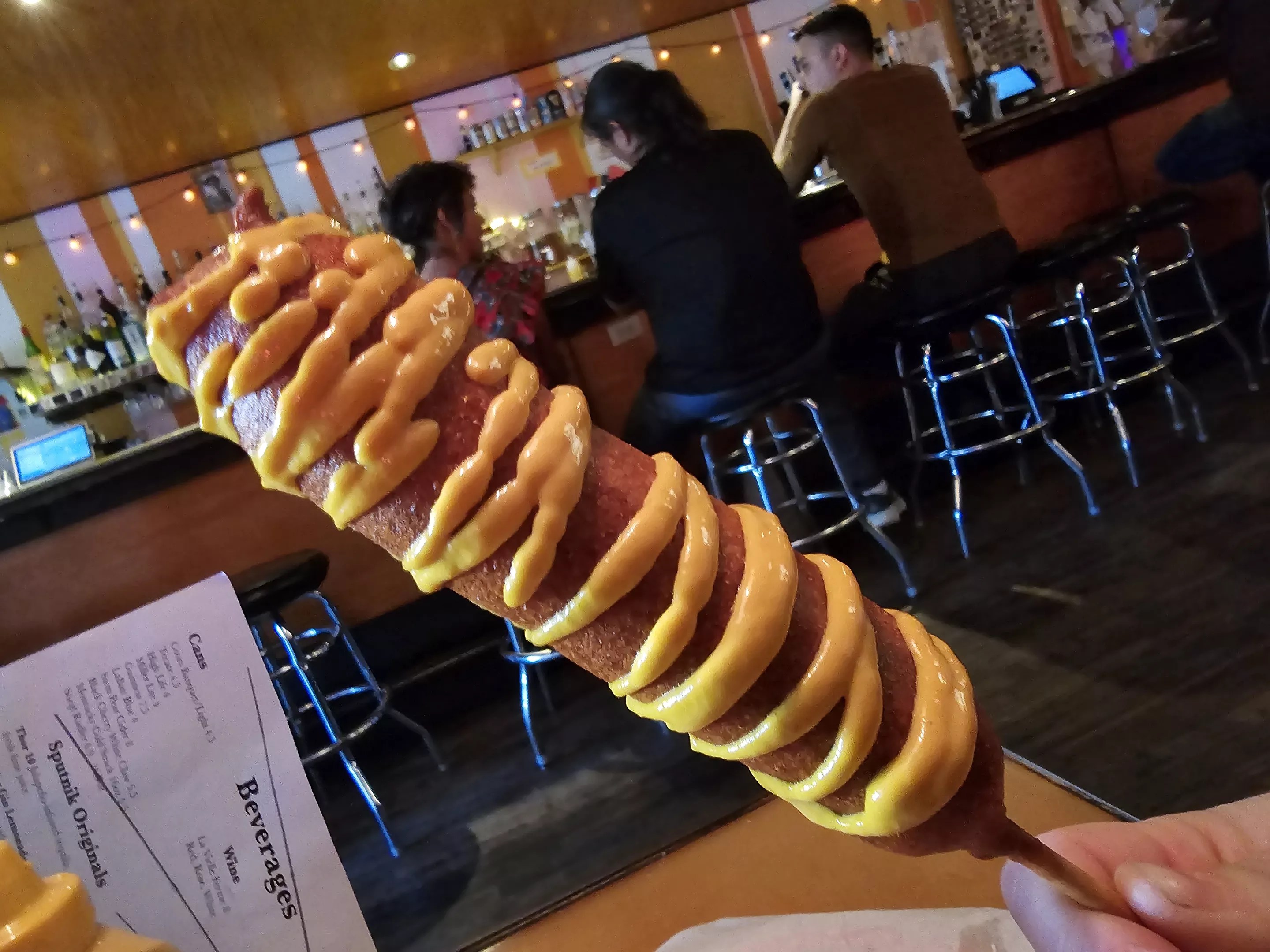 A corndog being held up in Sputnik
