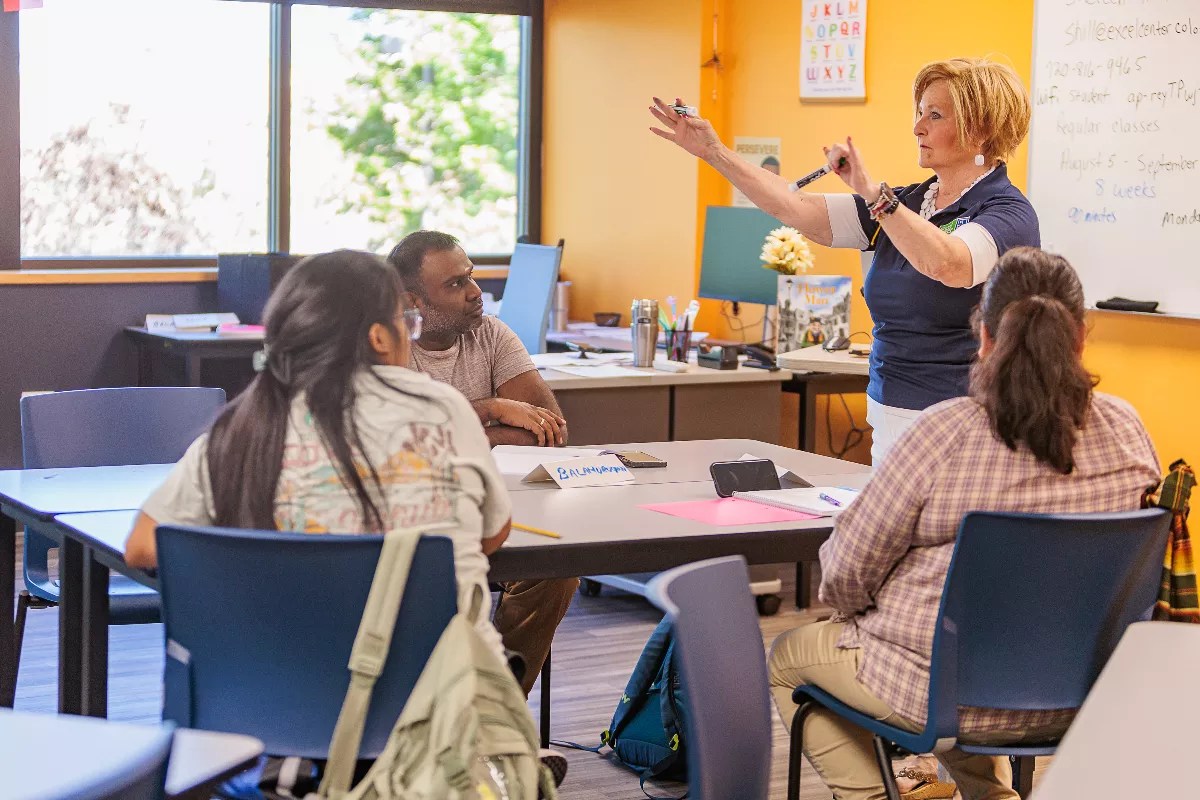 Adult students listen in a class.