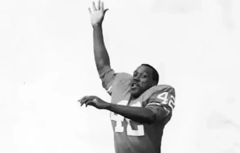 football player with arm up