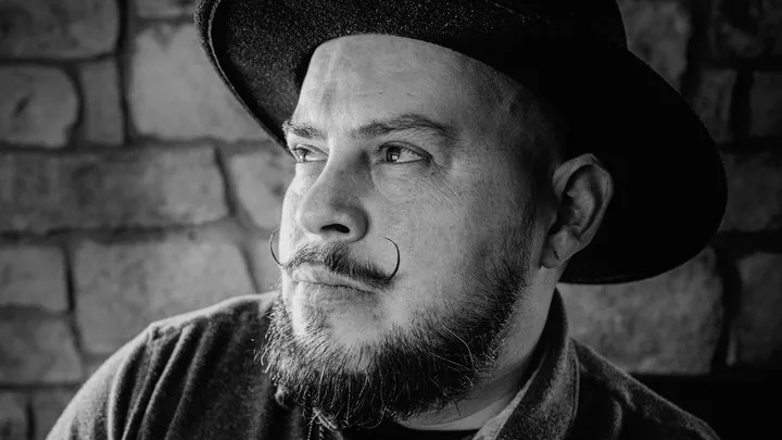 A closeup of Markham Maes's face