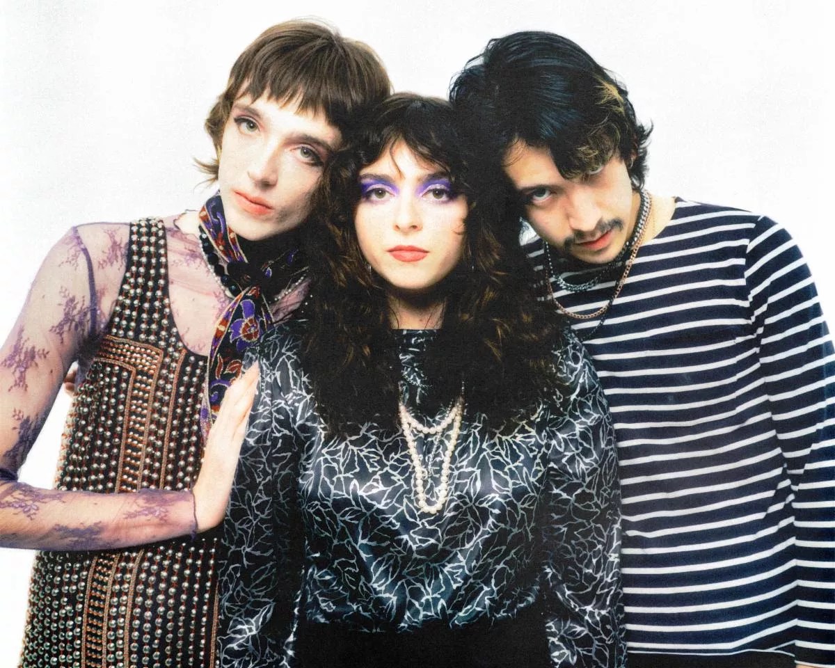 The three members of the Velveteers standing together