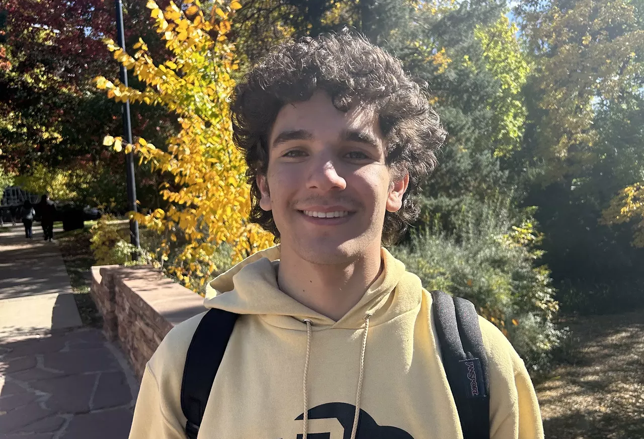 Manny Pargman wearing a CU Boulder hoodie.
