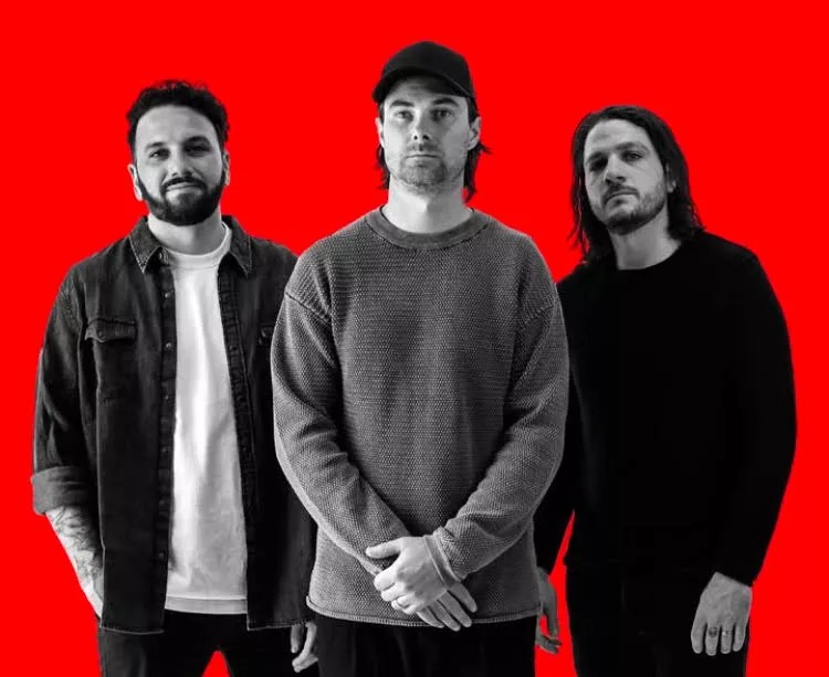 Three members of Drop Dead, Gorgeous standing