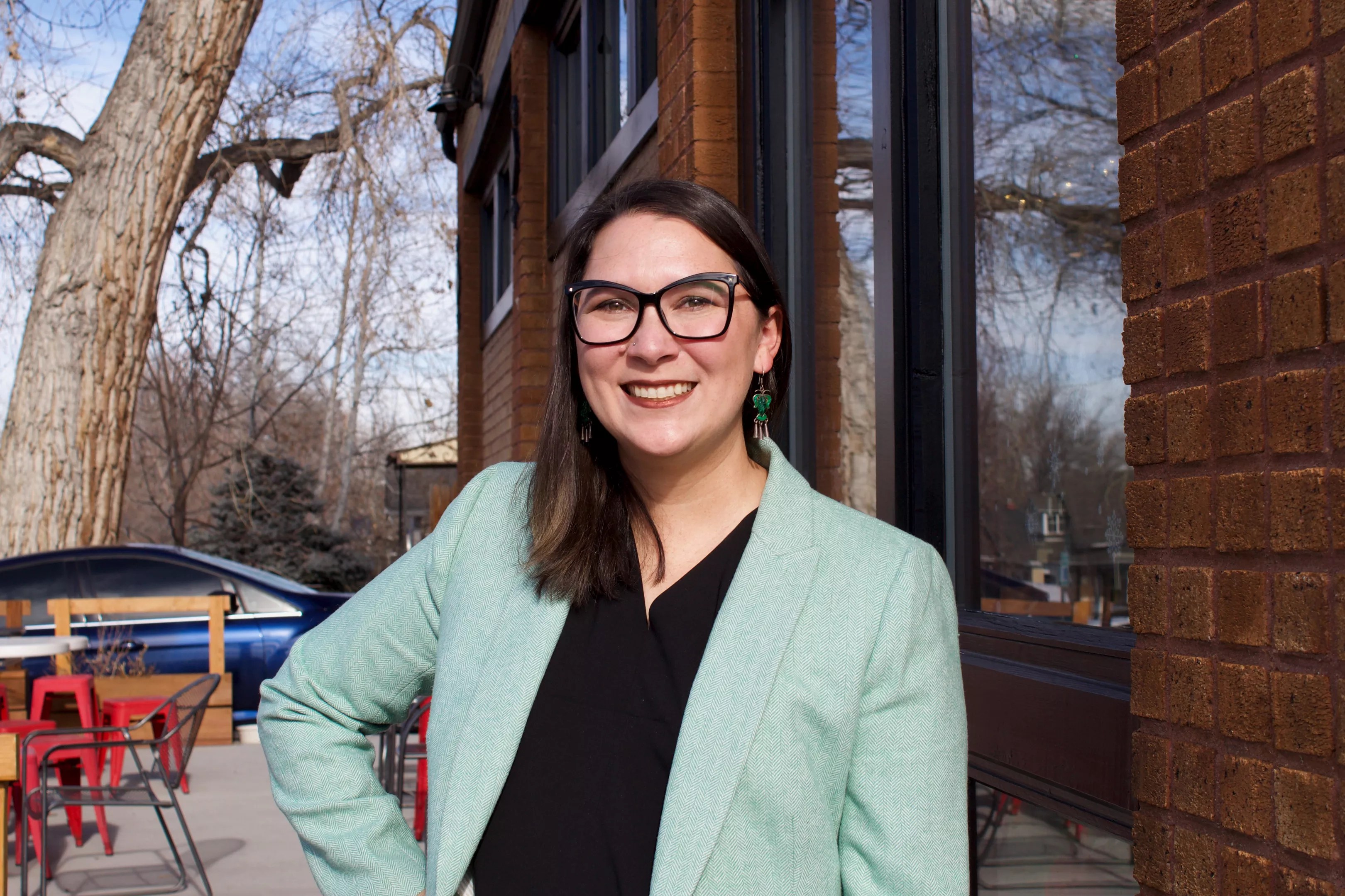 Amanda Gonzalez poses outside of a Denver coffee shop on Friday, January 3, 2025.